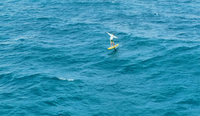 Josh Ku SUP hydrofoiling across the Bali Strait during his historic crossing
