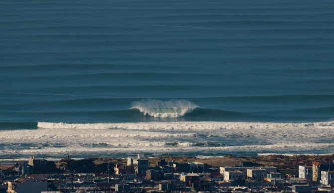 Surfer navigating a heavy winter barrel at Ocean Beach San Francisco