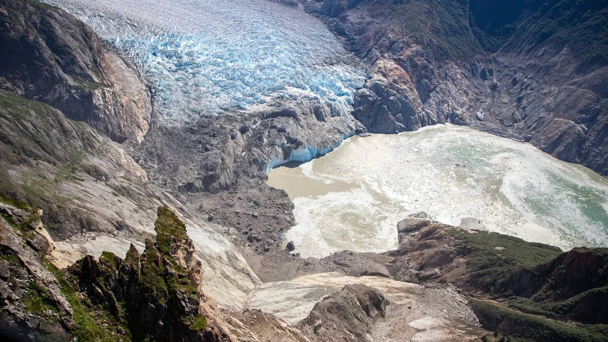 Aerial view of the scraped bare mountainside left by Alaska's 1,578-foot Tracy Arm tsunami