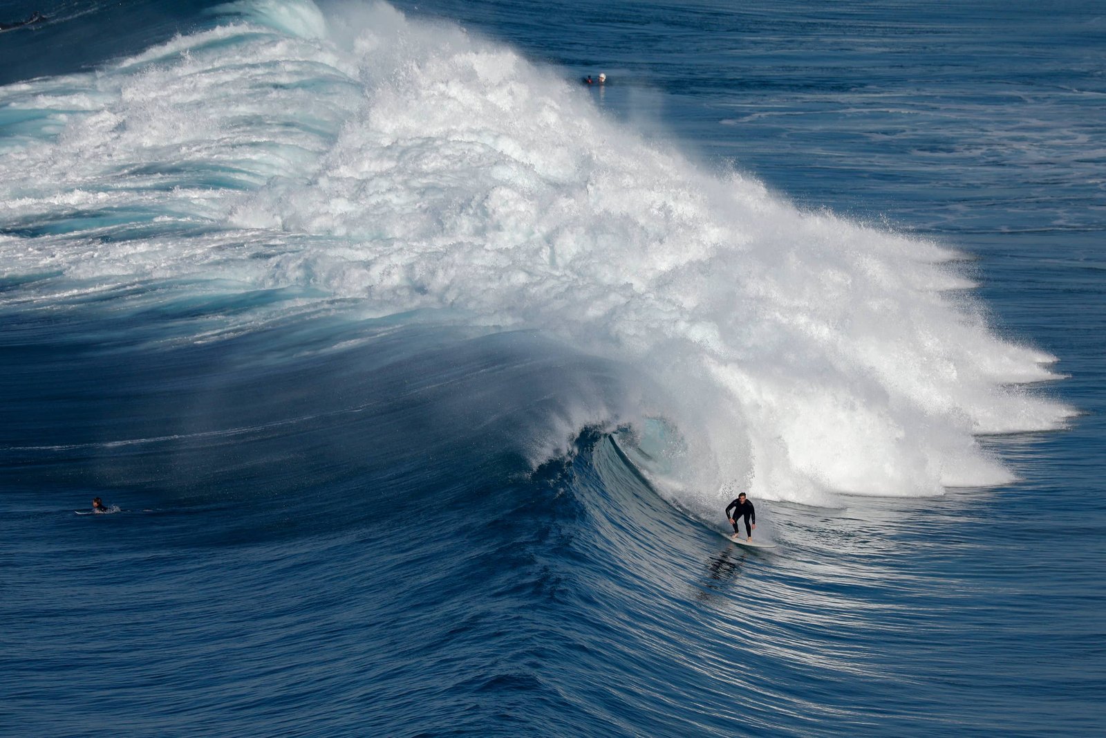 Surfer riding a wave at Black's Beach in La Jolla